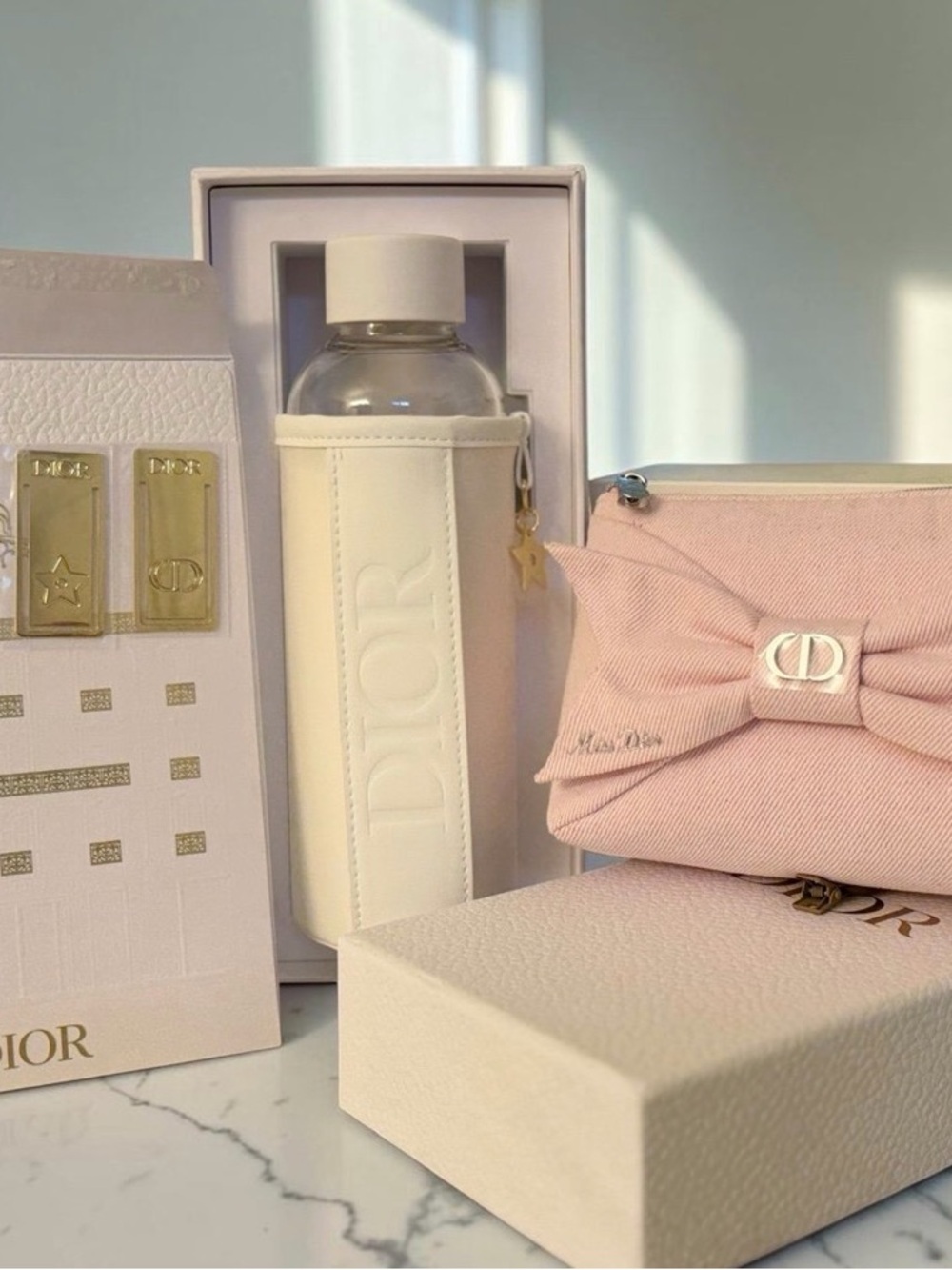 Dior Pink Bow Cosmetic Pouch, Glass water bottle, paper clips